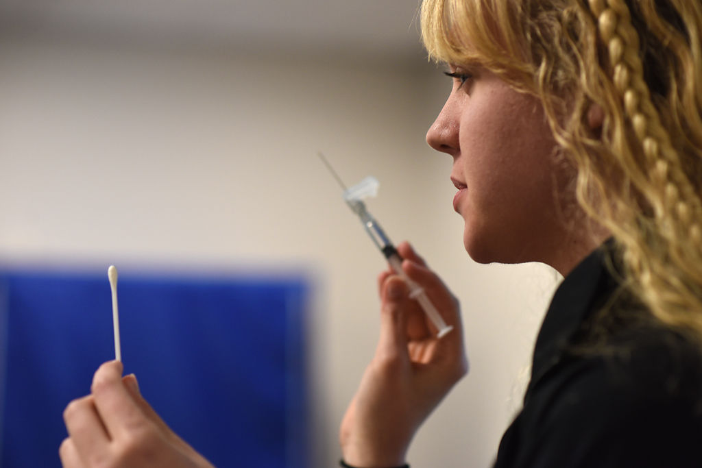 Victoria Ross demonstrates how to wet a swab